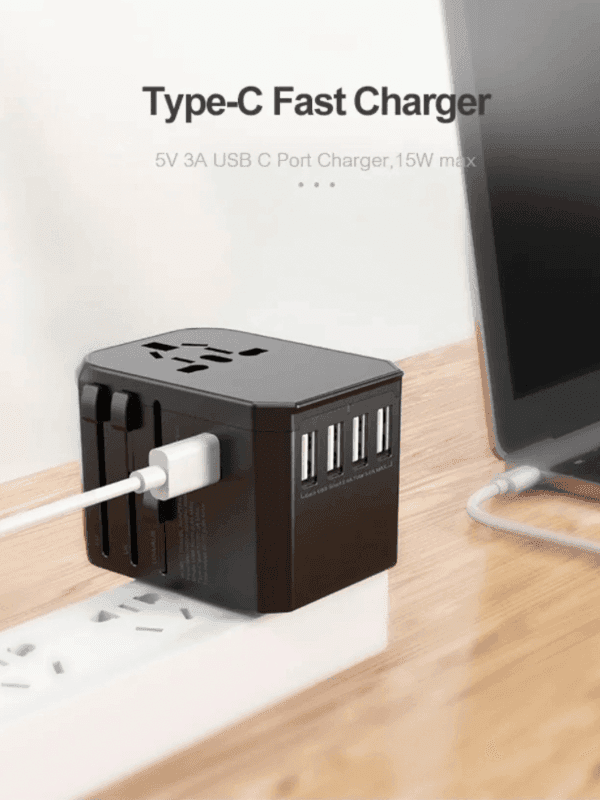 Type-C fast charger with four USB ports plugged into power strip on wooden desk, TUTT