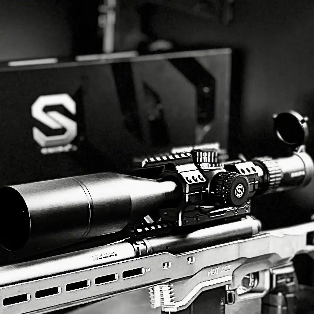 Close-up of SNIPA Rockies rifle scope with tactical mount on precision rifle, black background. TUTT