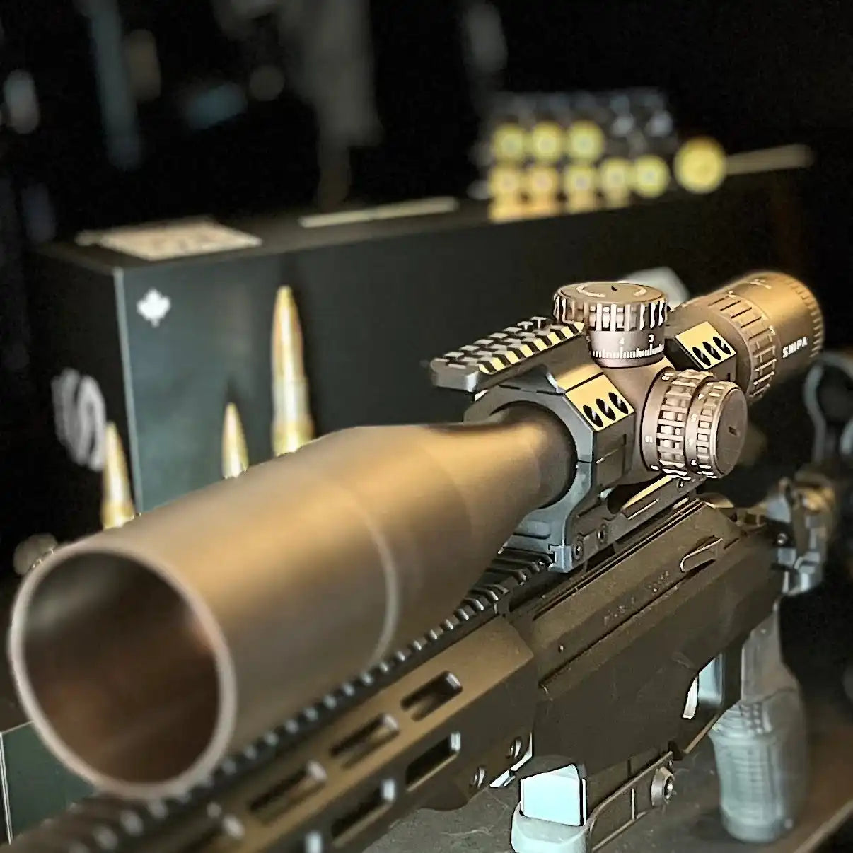 SNIPA Wolf ICE tactical rifle scope mounted on rifle with visible adjustment dials and sunshade. TUTT