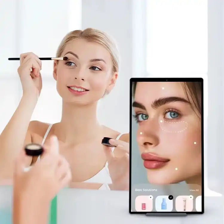 Woman applying makeup using a TUTT 21.5 inch smart Android display in a bright room TUTT