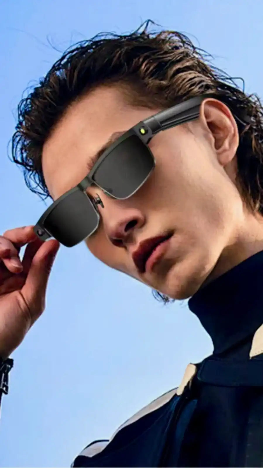 Man wearing stylish AI smart glasses with gradient lenses outdoors, close-up. TUTT
