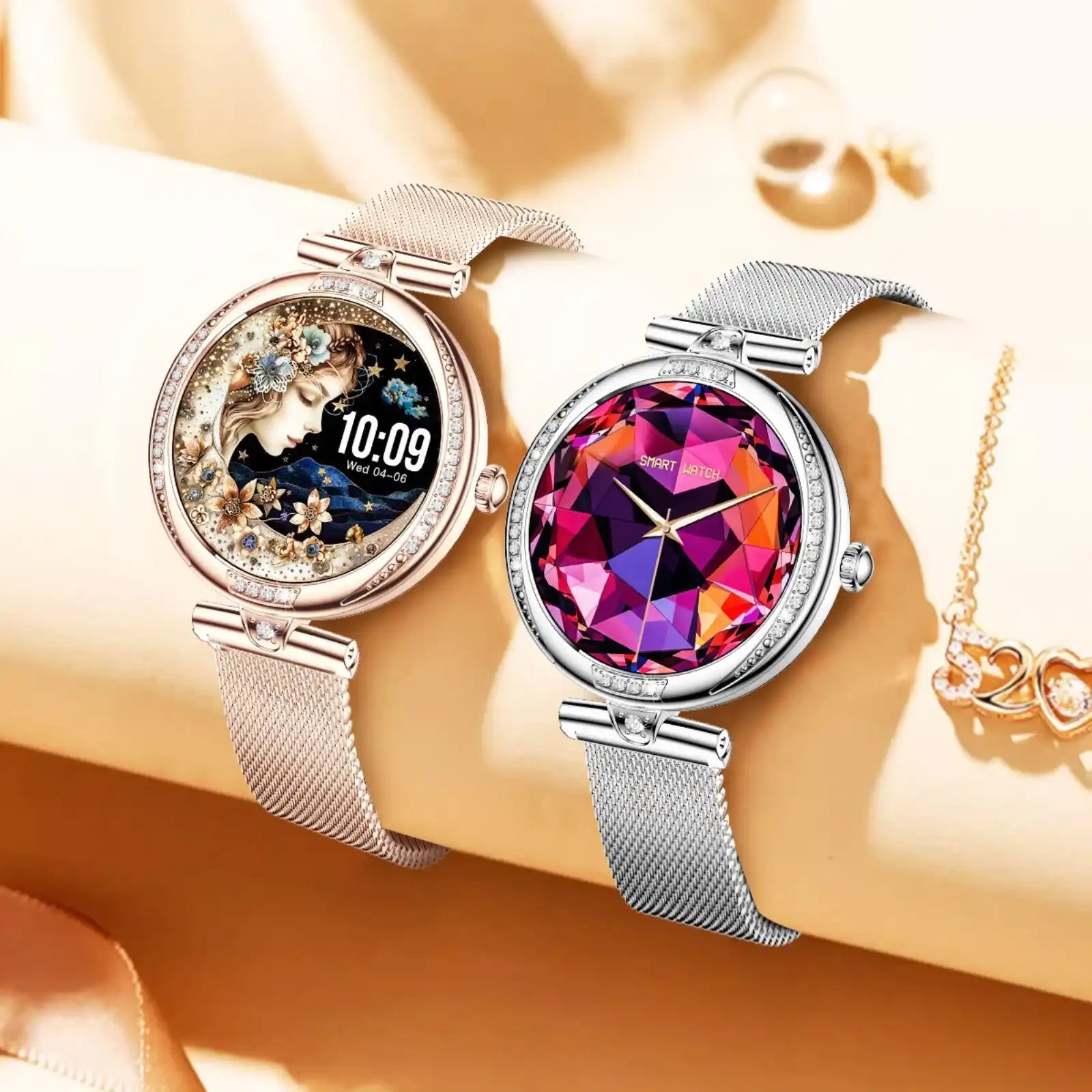 Two TUTT NX17 Pro smart watches for women with mesh straps on a beige surface, one showing a floral artistic face and the other with a colorful gem-like digital face, both surrounded by decorative jewelry. TUTT