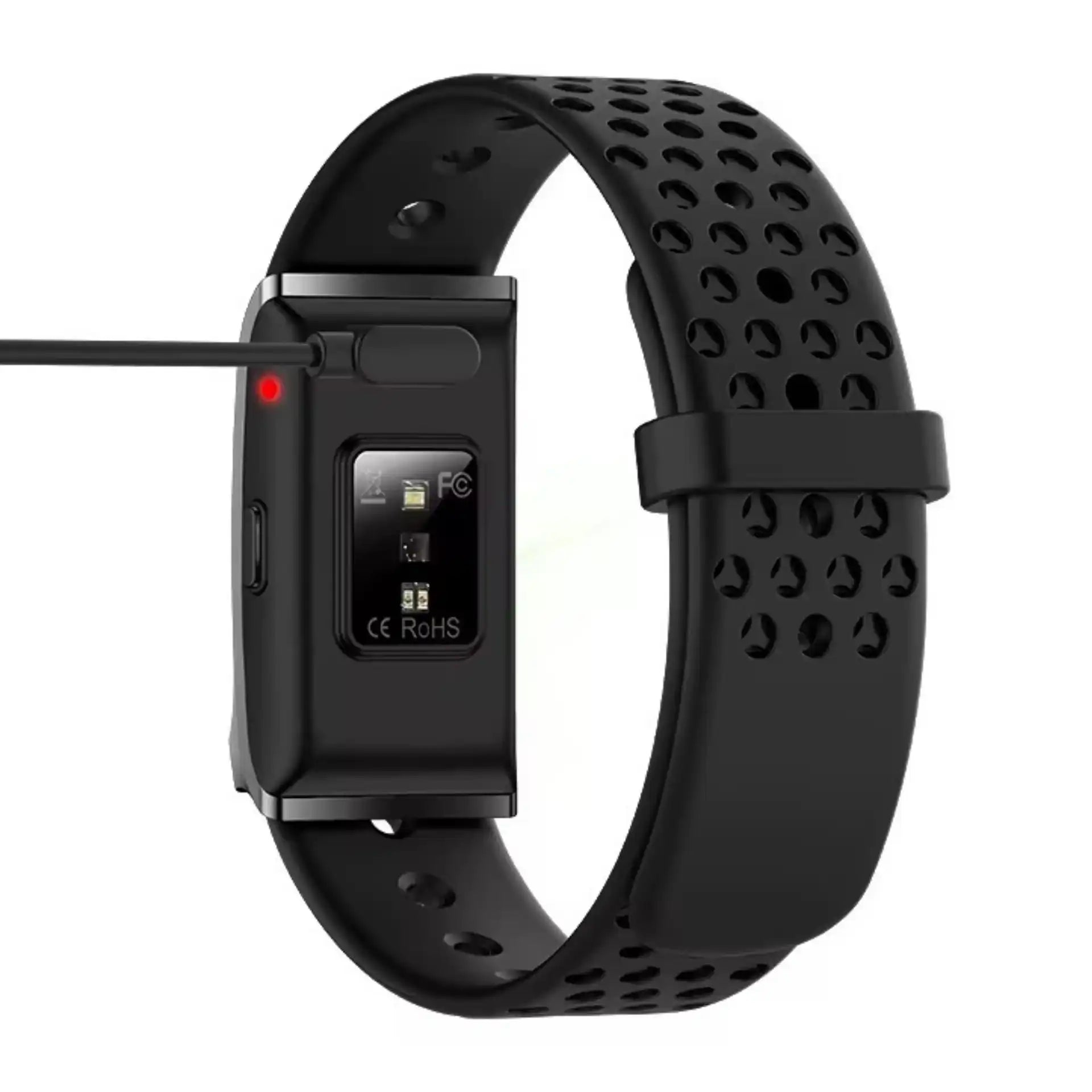 Black smart fitness bracelet with perforated strap shown charging via USB cable, TUTT at end.