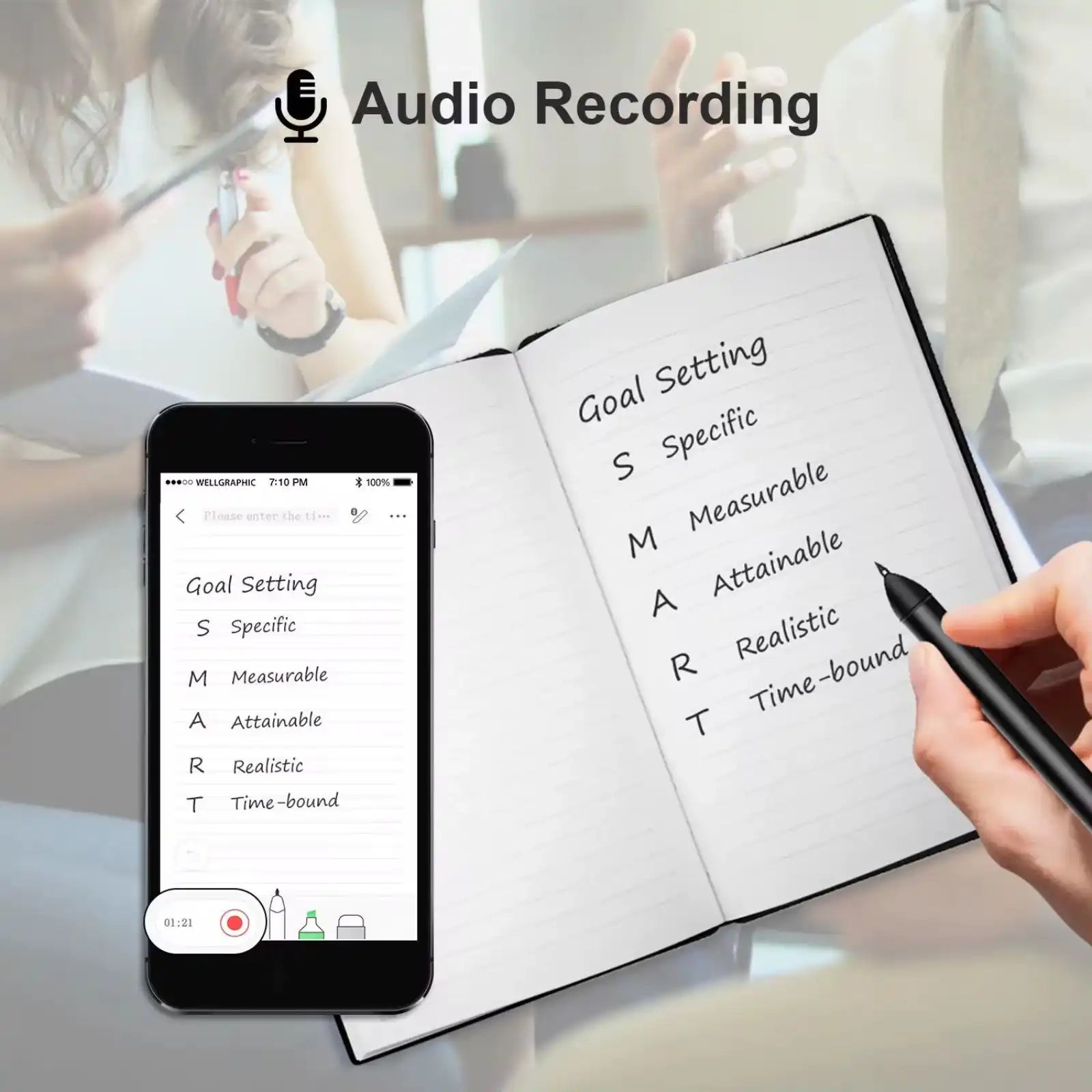 Hand writing SMART goal setting notes in notebook with smartphone recording audio in meeting background TUTT