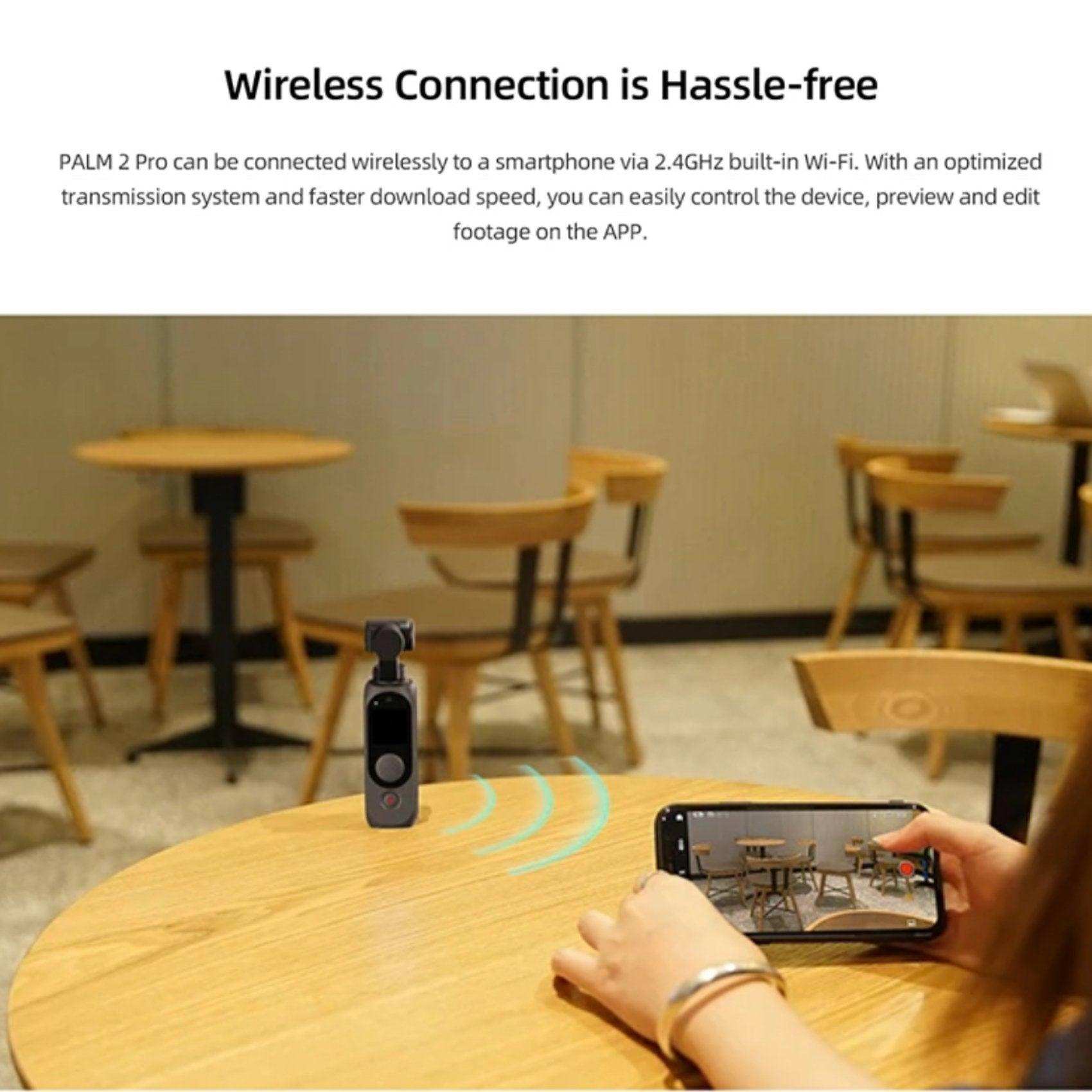 Fimi Palm 2 Pro handheld gimbal camera wirelessly connecting to a smartphone on a café table TUTT