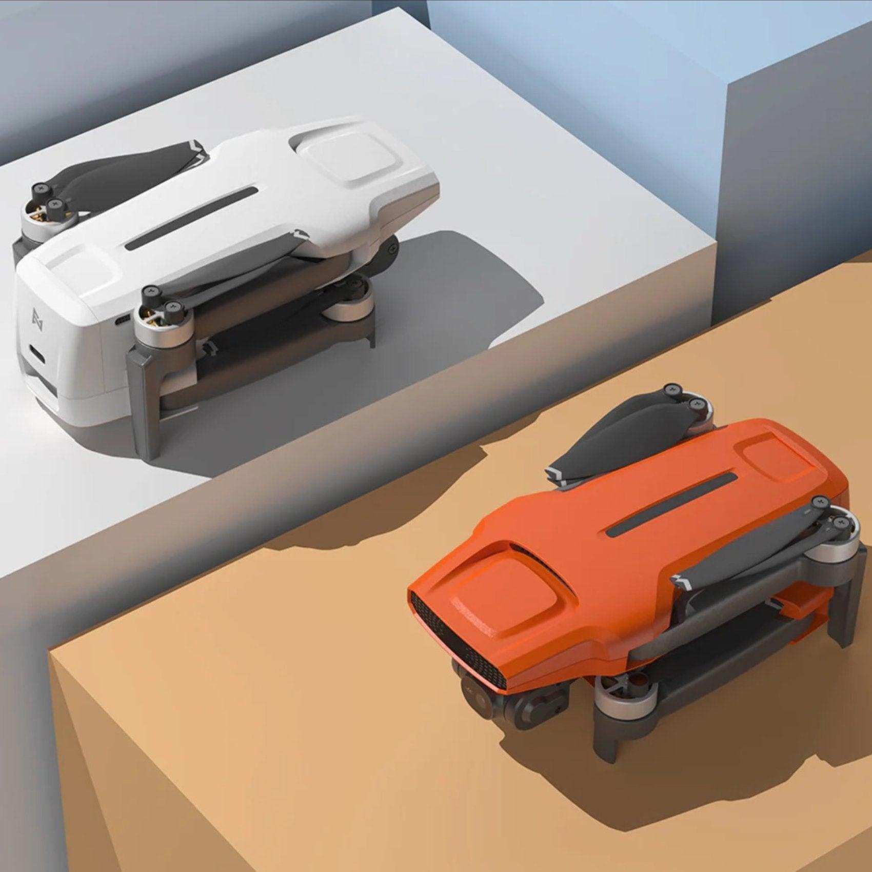 Folded Fimi X8 Mini V2 GPS drones in white and orange on geometric surfaces, 4K camera TUTT