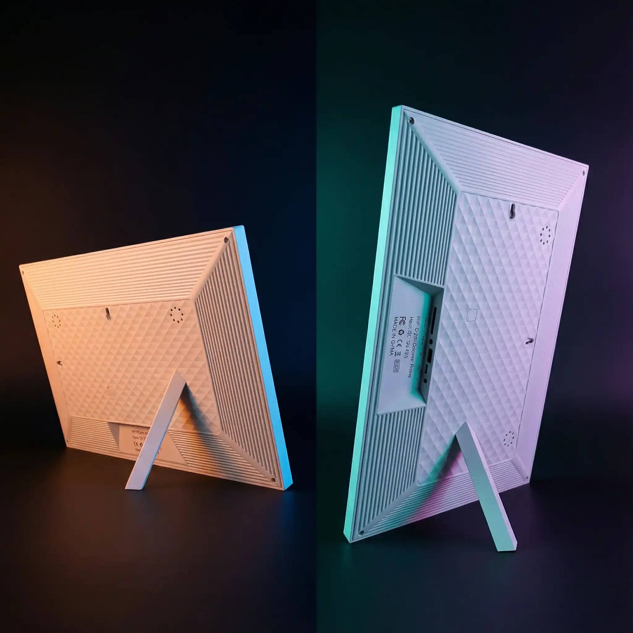 Back view of two white smart digital calendar frames with textured panels and fold-out stands, side by side. TUTT