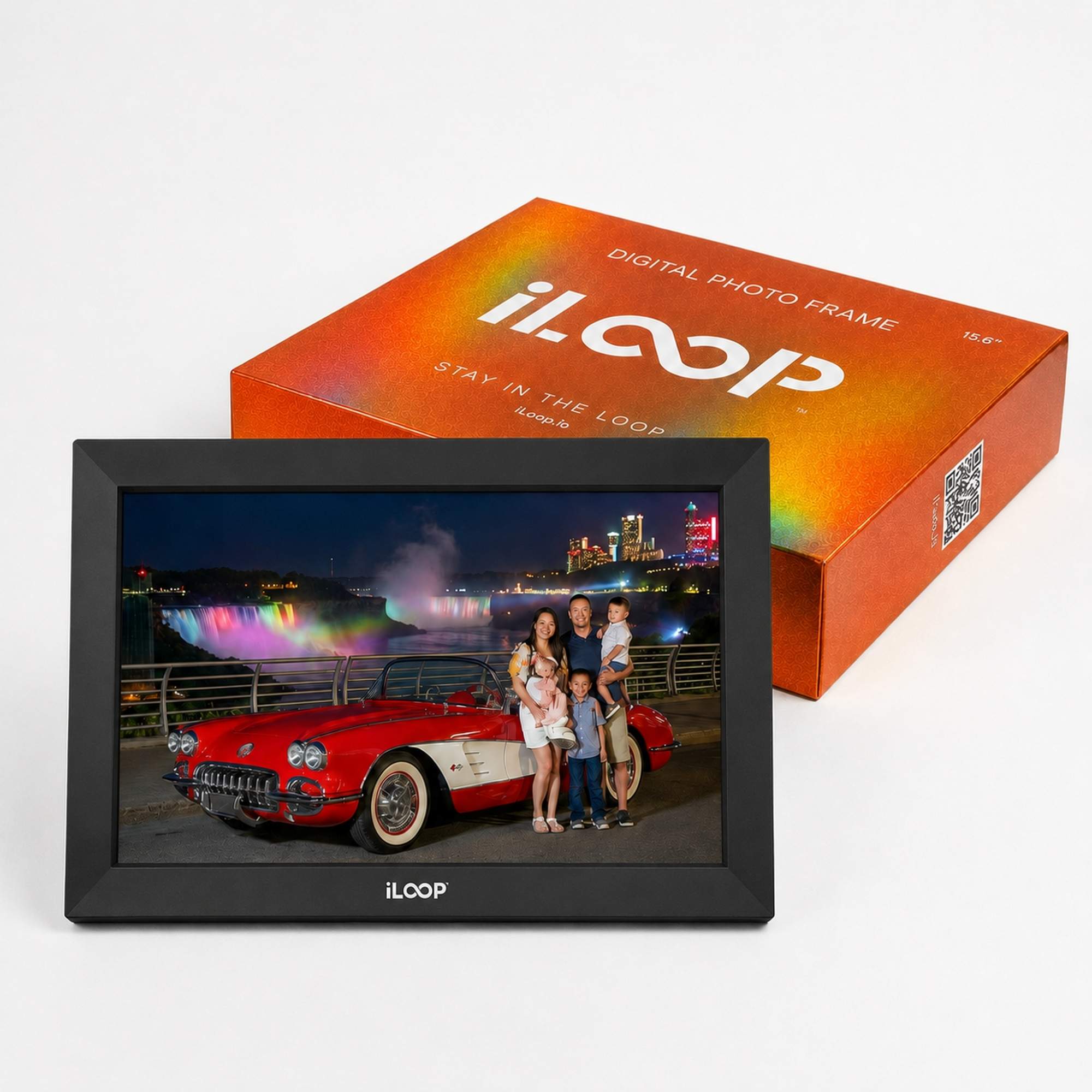 An iLOOP digital photo frame displaying a colorful night scene with a red classic car and a family, shown in front of its orange product box on a clean white background.