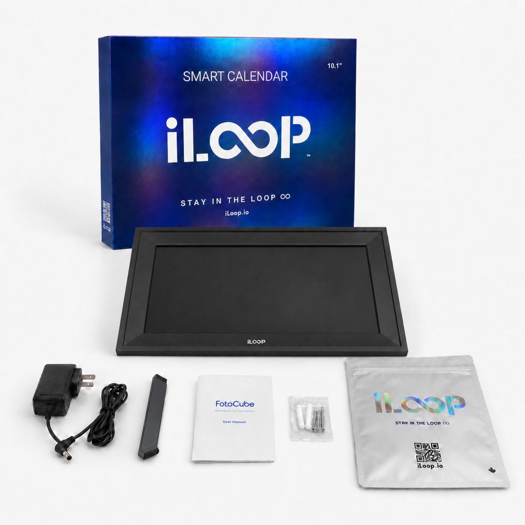 iLoop smart calendar 10.1 inch display kit with its retail box, power adapter, pen, manual, and storage pouch on a white background.