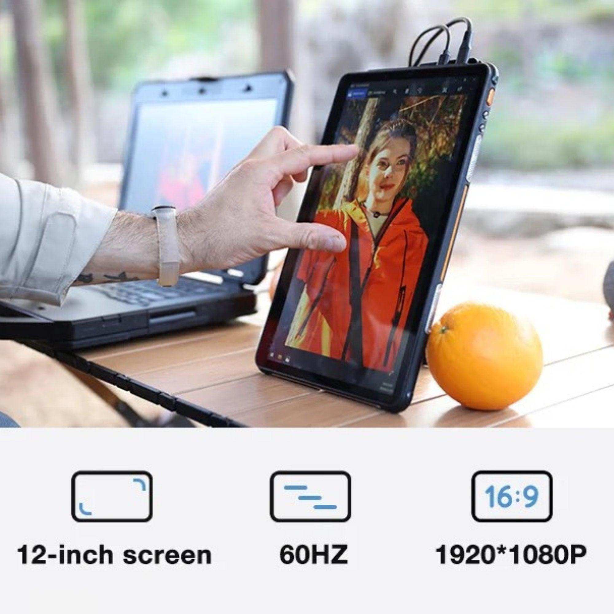 Hand using rugged 12-inch touchscreen portable monitor outdoors next to laptop and orange, TUTT