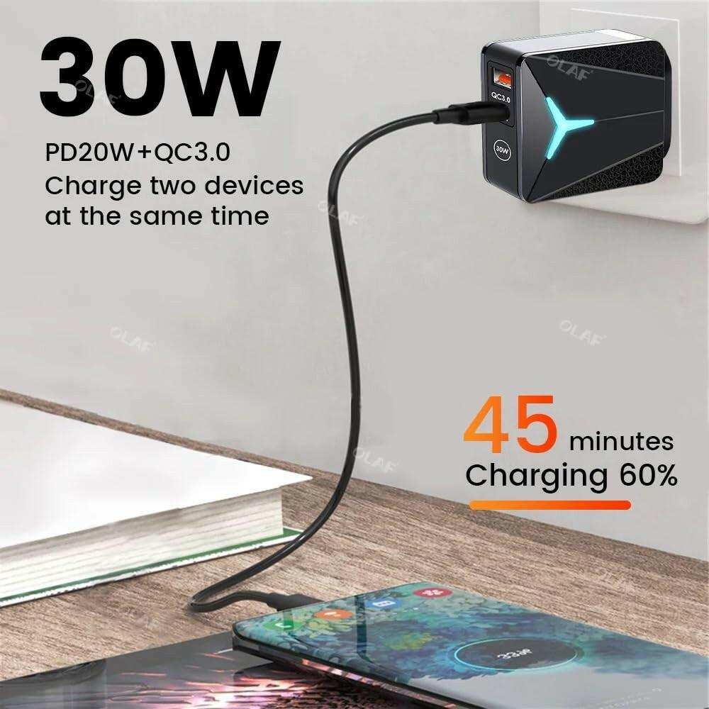 30W fast charger with Type-C and USB ports plugged in, charging a smartphone on a desk, TUTT