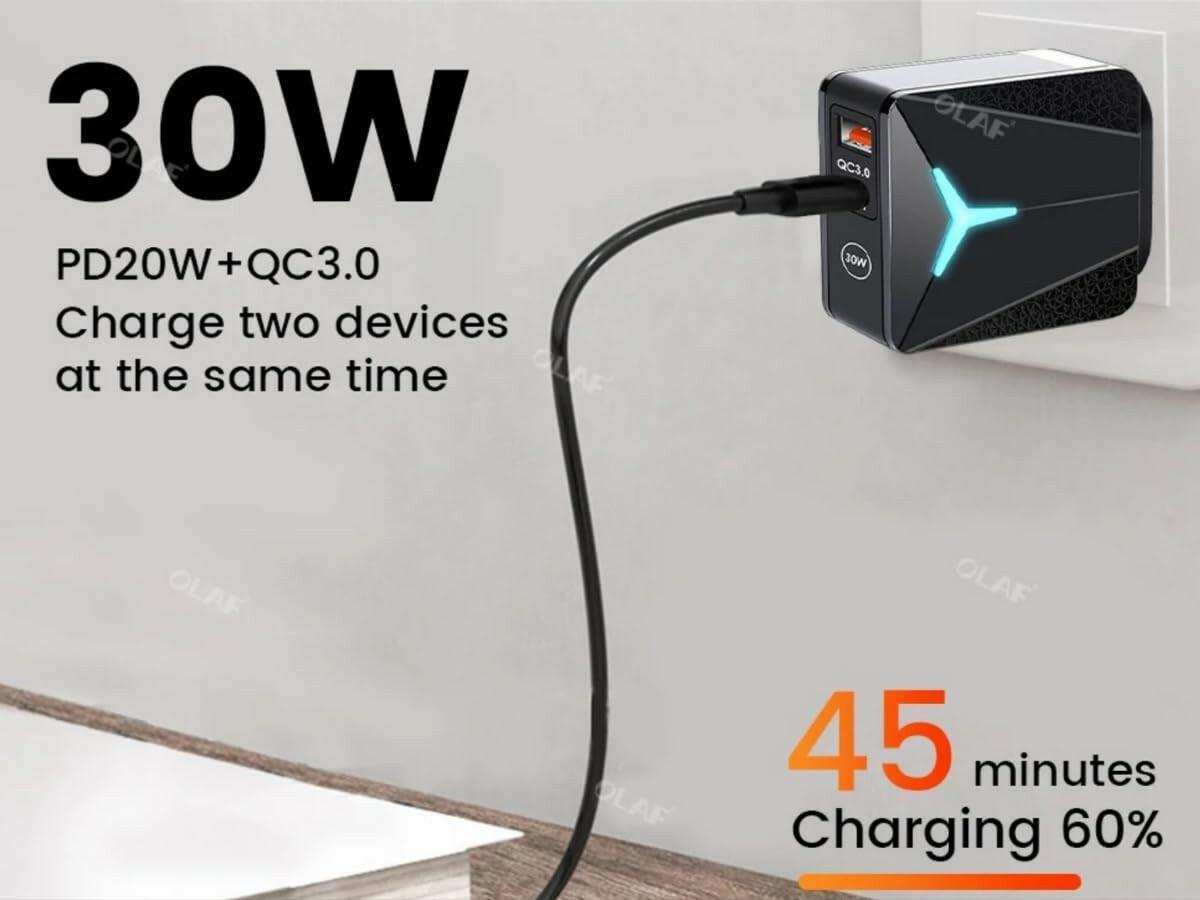 30W dual-port USB wall charger with glowing LED light, plugged into an outlet, fast charging two devices at once