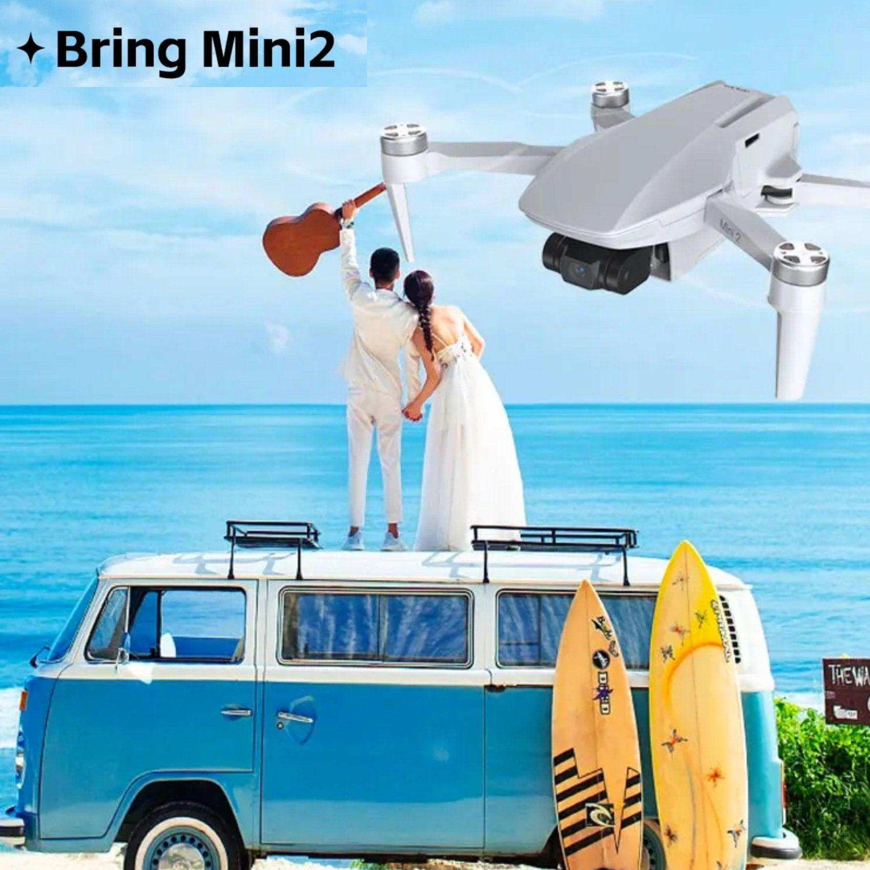 Mini2 drone flying over blue van with couple, surfboards, ocean view, and clear sky, TUTT