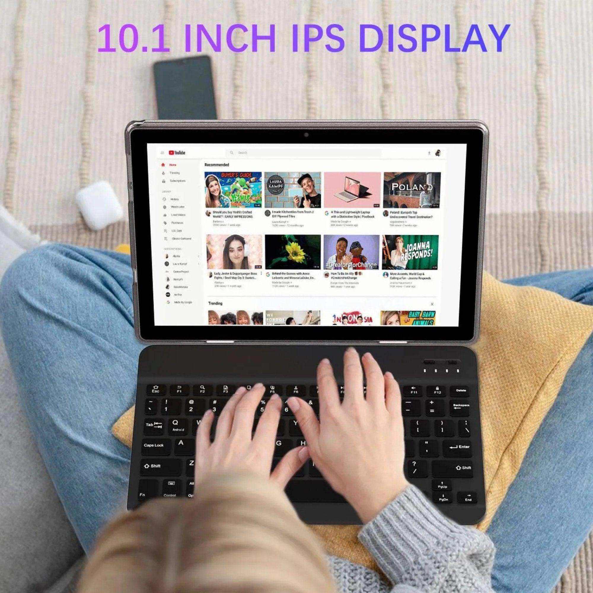 Person using 10.1 inch IPS display tablet with keyboard on lap, YouTube open, TUTT