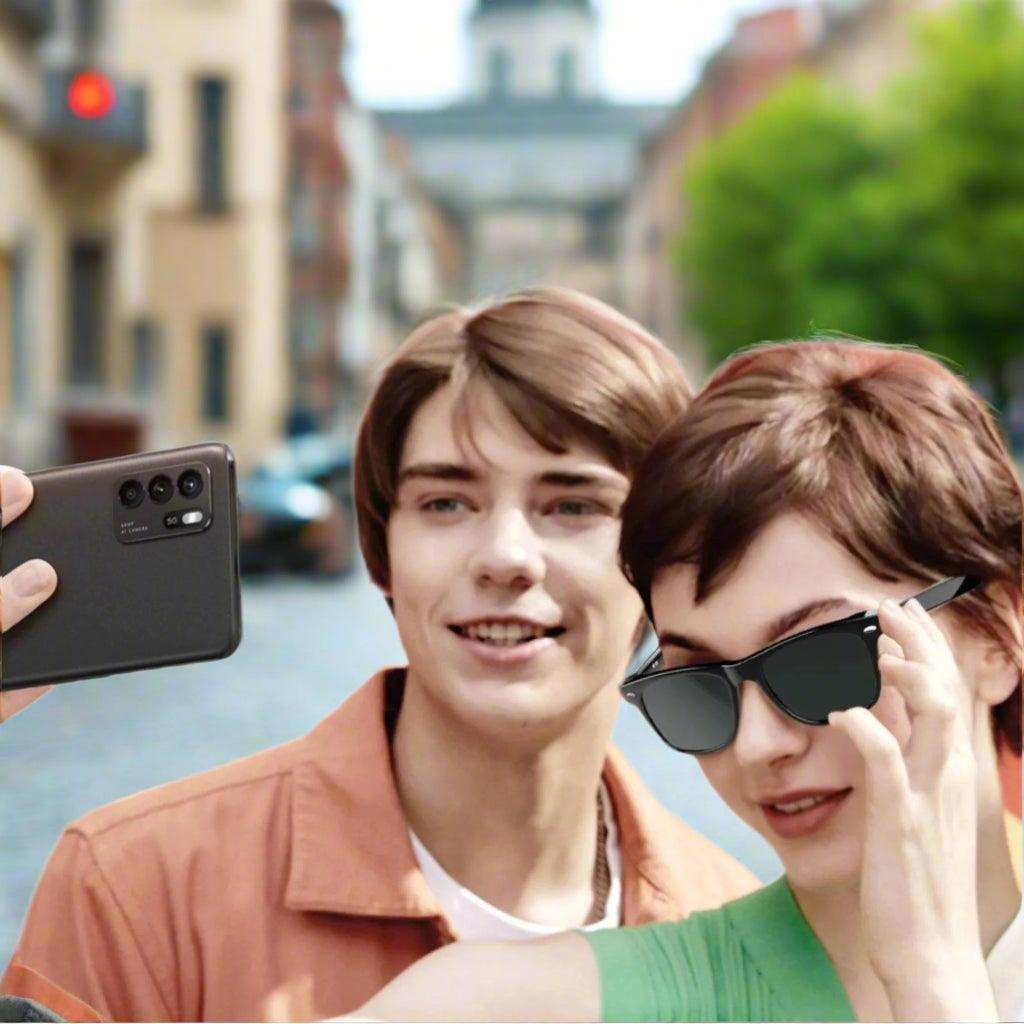 Two people taking a selfie outdoors, woman wearing Bluetooth smart sunglasses, TUTT