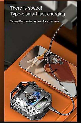 TUTT H9 TWS gaming headset in zinc alloy charging case connected to a smartphone via Type-C fast charging, displayed on an orange surface with battery indicator visible. TUTT