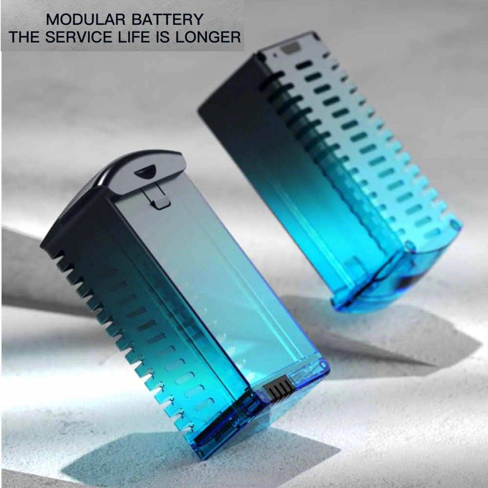 Two blue modular drone batteries on a light surface, promoting long battery life. TUTT