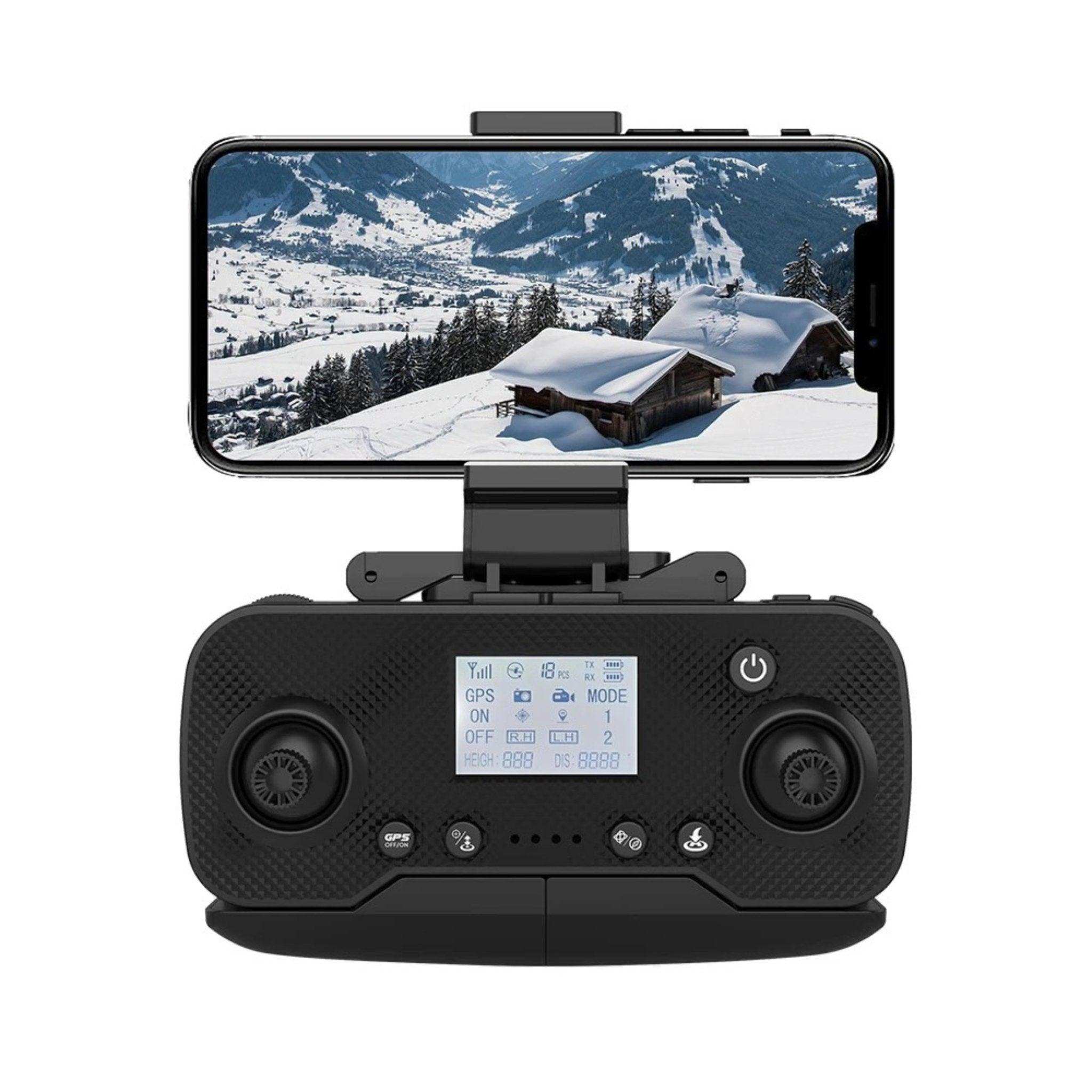 Drone remote controller with smartphone display showing snowy mountain landscape, TUTT