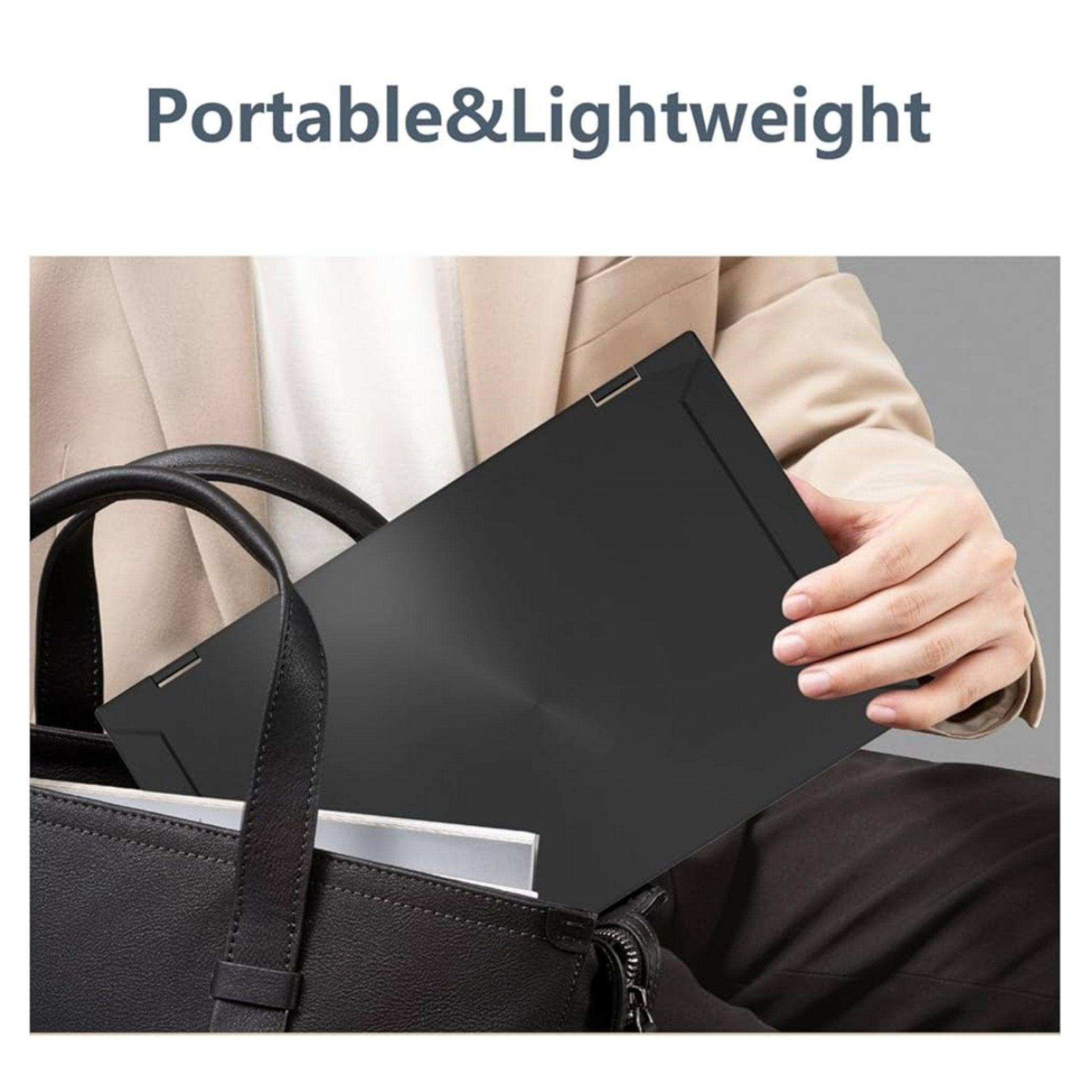 Person placing a portable, lightweight laptop screen extender into a black bag, TUTT