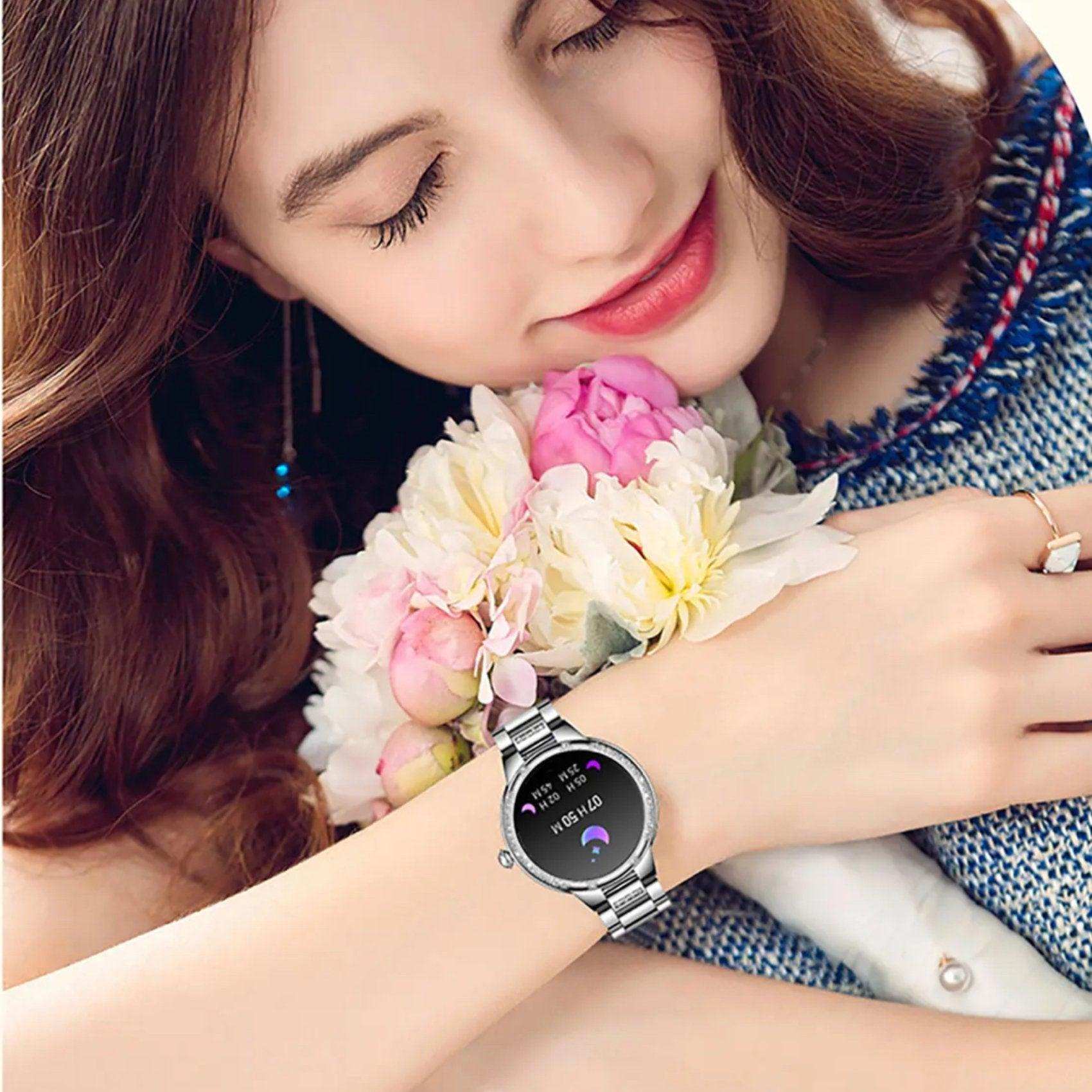 Woman holding bouquet, wearing silver AMOLED screen ladies smartwatch, health pedometer TUTT