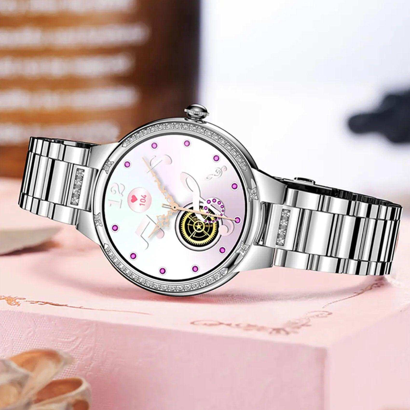 Silver ladies' AMOLED screen smart watch with health features on a pink gift box, TUTT
