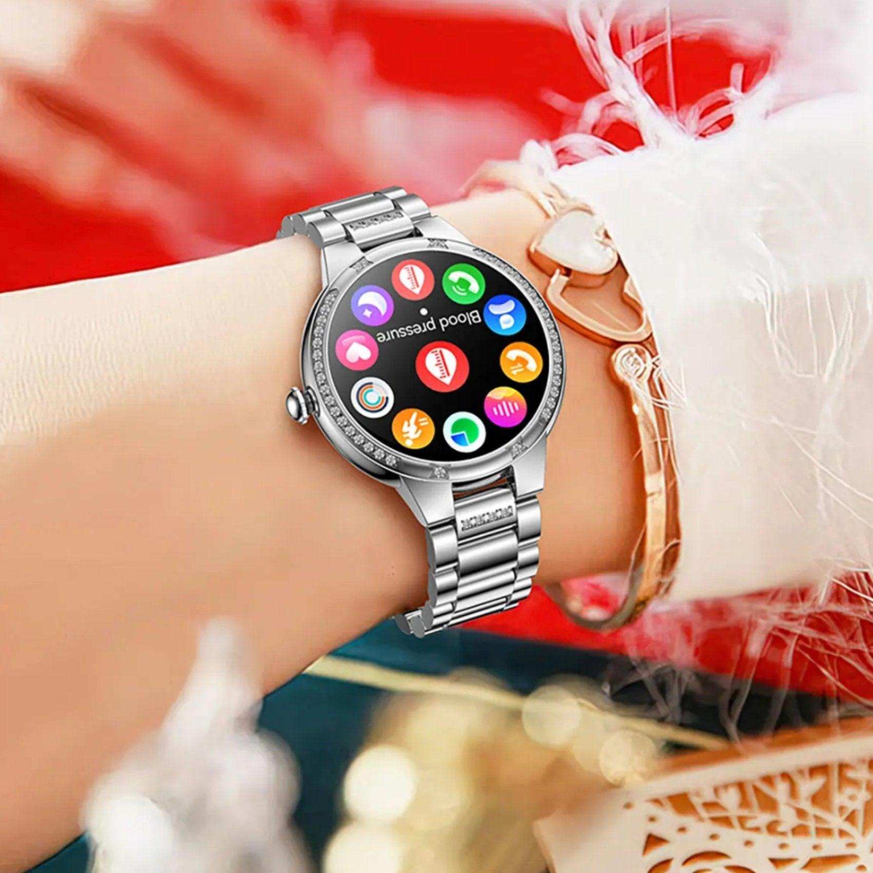 Silver ladies AMOLED screen health smart watch with colorful app icons on wrist, TUTT