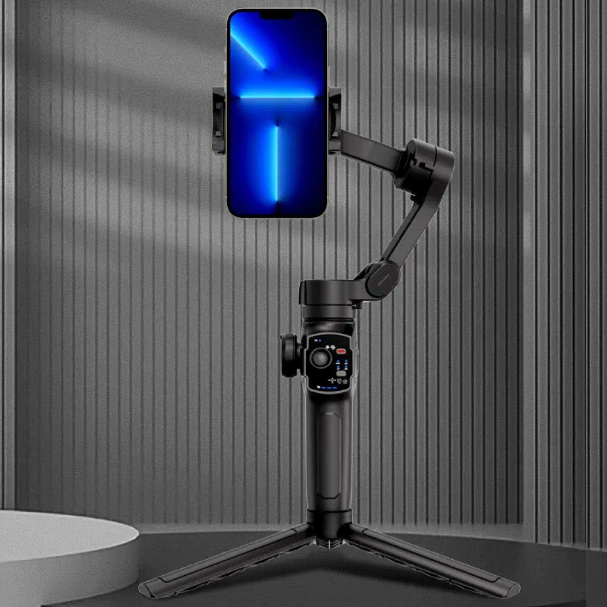 3-axis handheld smartphone gimbal stabilizer with tripod and phone mounted, black background TUTT