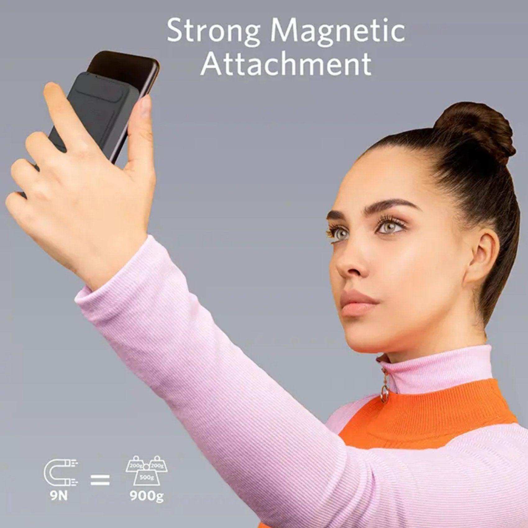 Woman holding iPhone with magnetic wireless portable power bank, strong attachment, gray background TUTT