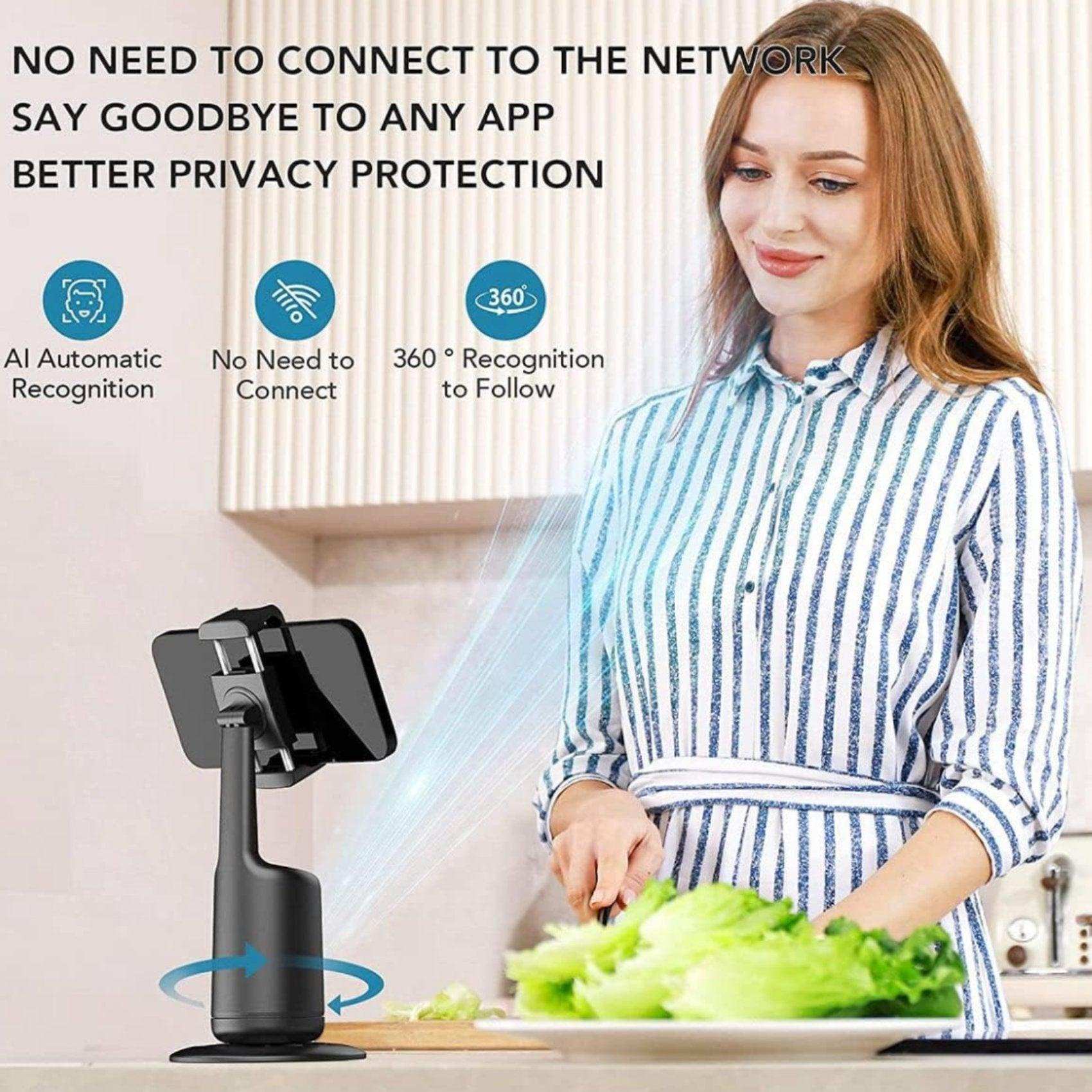 Woman using 360° auto face tracking phone holder gimbal on kitchen counter, chopping vegetables, TUTT