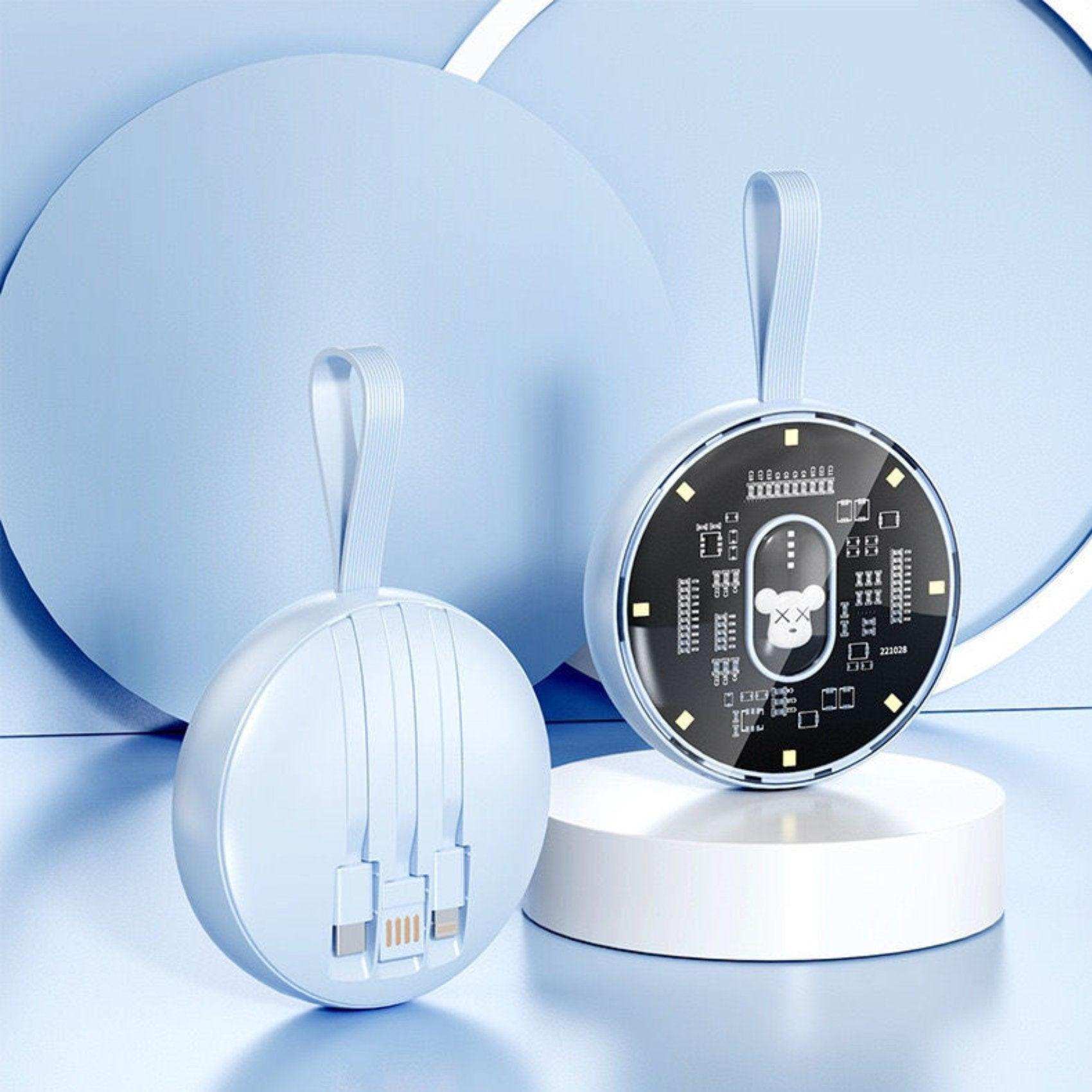 Round blue TUTT P3 power bank with built-in cables and LED night light on pastel background TUTT