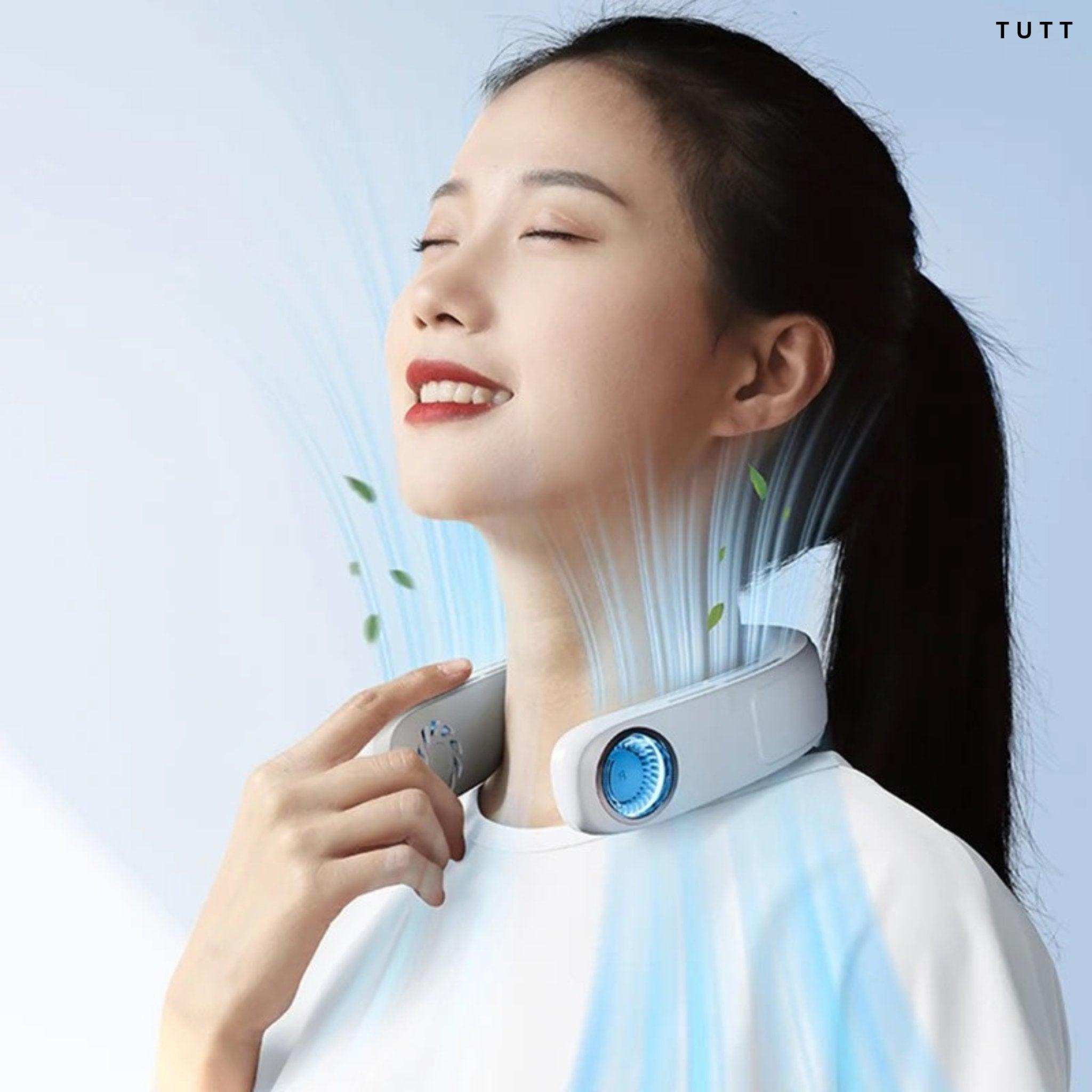 Woman smiling wearing a bladeless portable neck cooling fan with blue cooling effect, TUTT