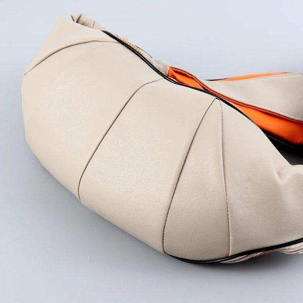 Beige shiatsu neck and shoulder massager with orange lining on a gray background, TUTT
