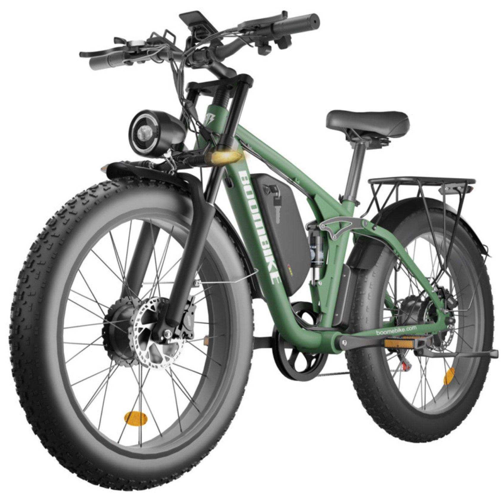 Green electric mountain bike with fat tires, front light, rear rack, and disc brakes, TUTT