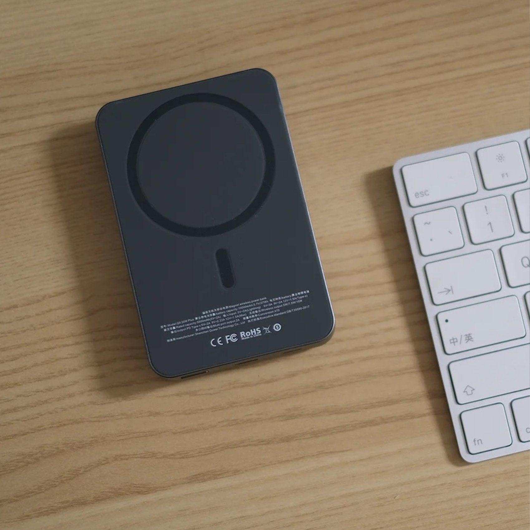 All-metal MagSafe wireless power bank on desk beside white keyboard, portable charger TUTT