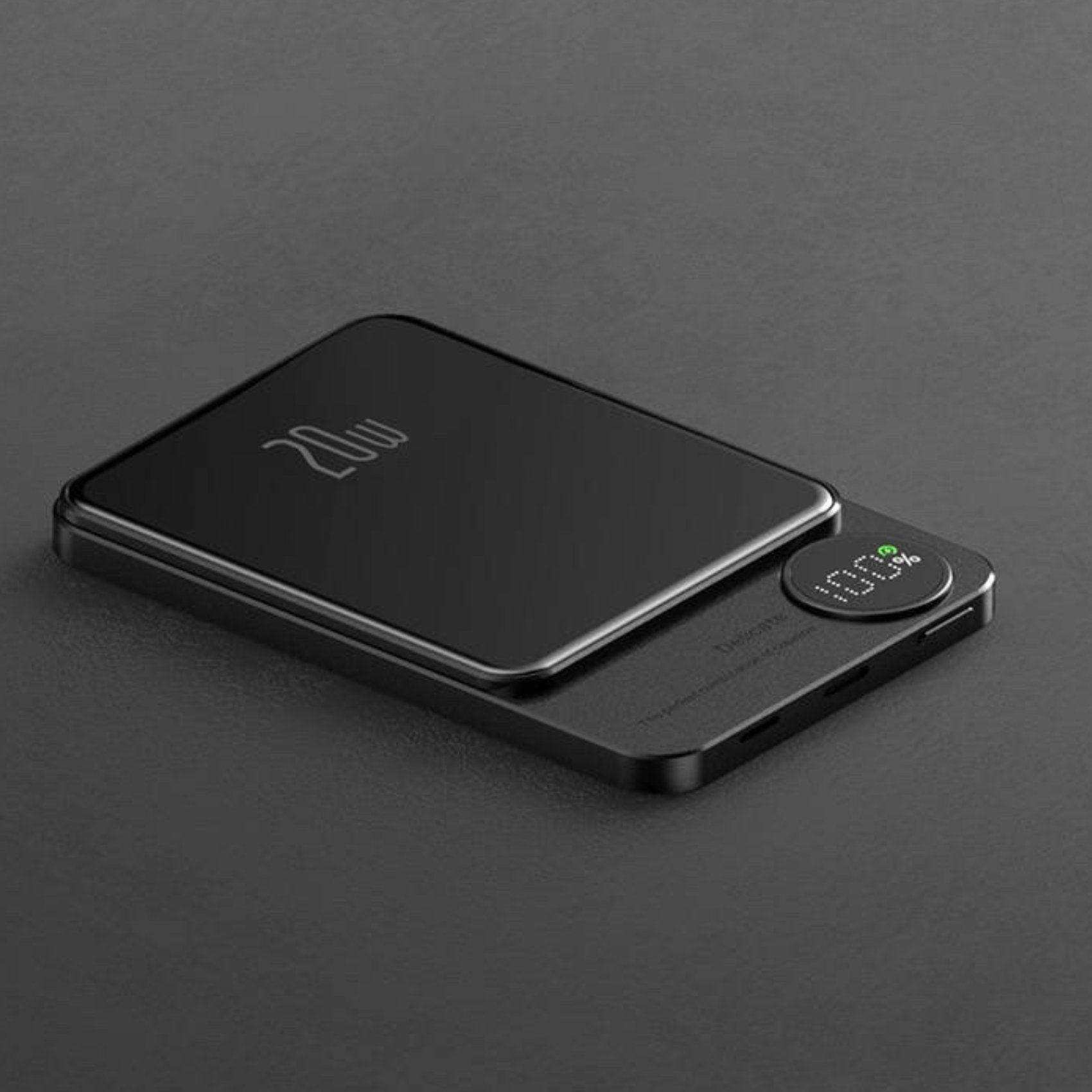 Black MagSafe wireless power bank with LED display and 20W fast charging on gray surface TUTT