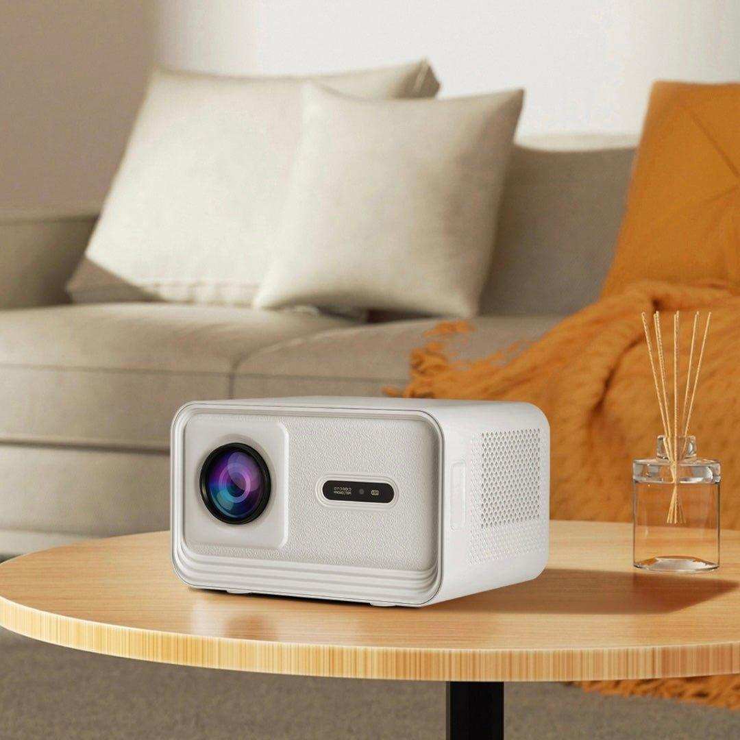 White smart home theatre projector on a wooden table in cozy living room setting TUTT