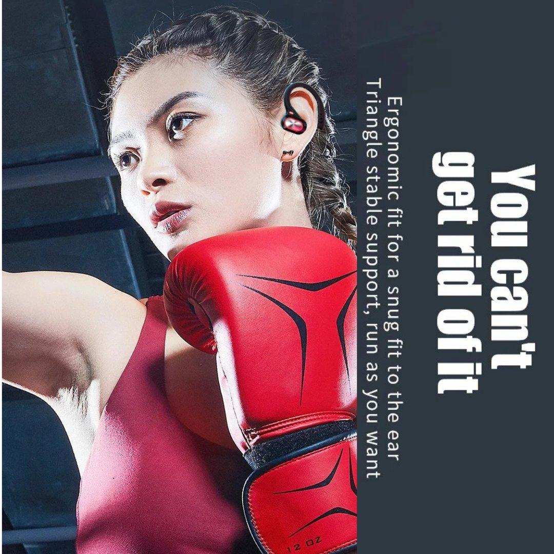 Woman wearing red boxing gloves and wireless Bluetooth earbuds, fitness focus, TUTT