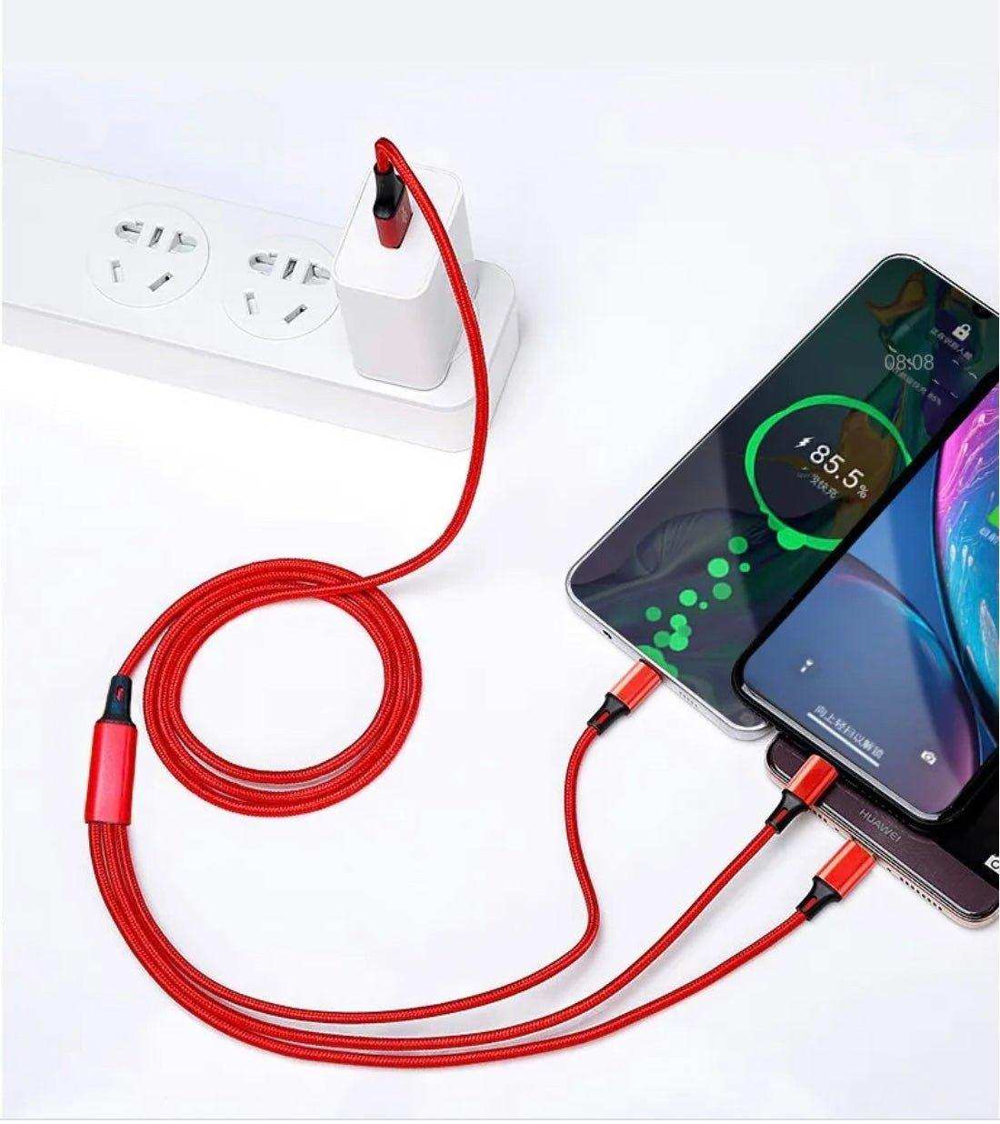 Red 3-in-1 charging cable connected to power strip and three smartphones charging, TUTT