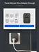 Universal travel adapter with multiple international plug types shown and plugged into wall, TUTT