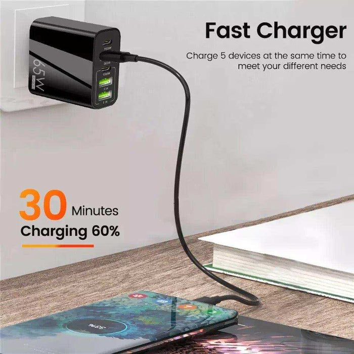 65W fast charger plugged in, charging a smartphone on a desk with 30 minutes 60% speed, TUTT