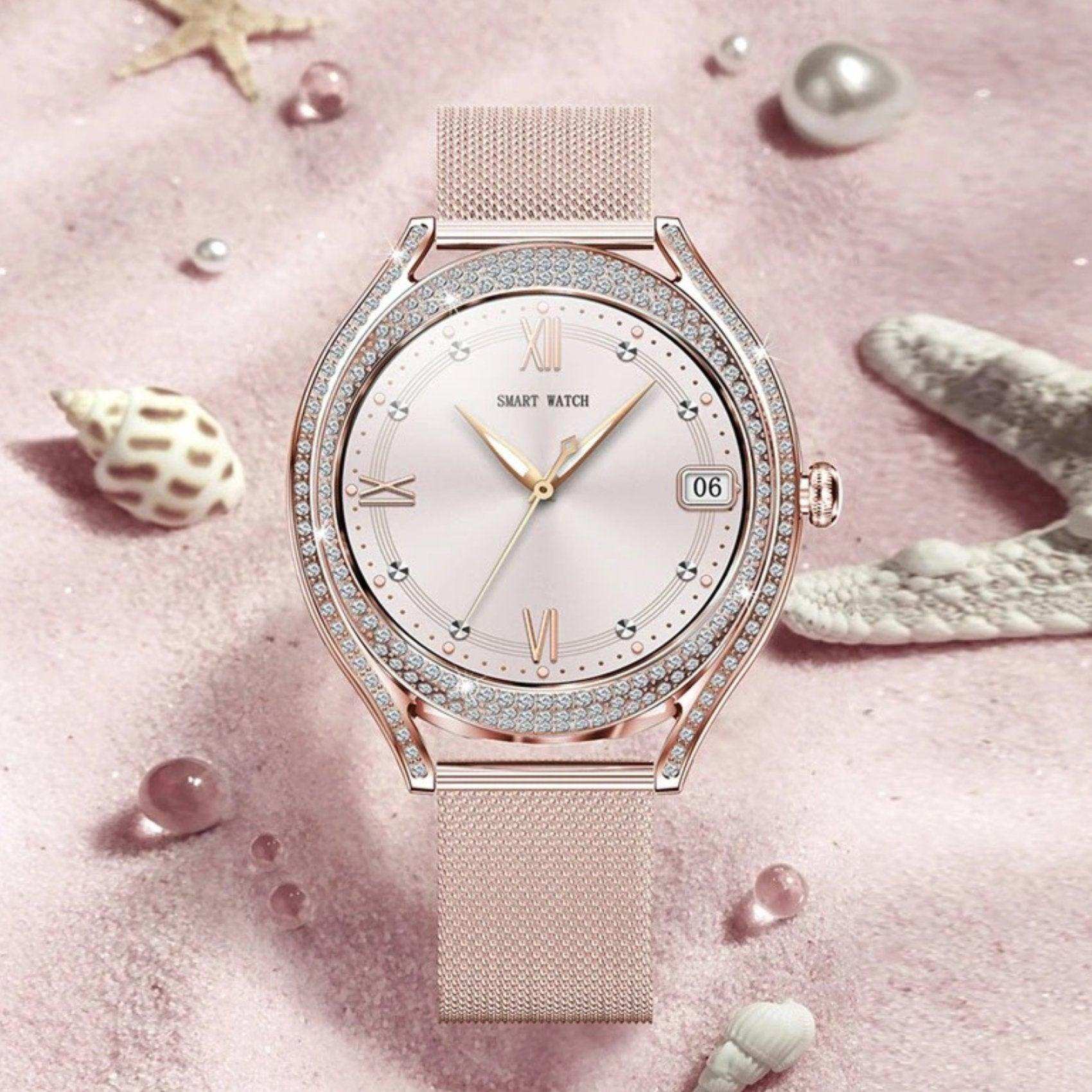 Rose gold ladies smart watch with crystal bezel on pink sand, seashells, and starfish, TUTT