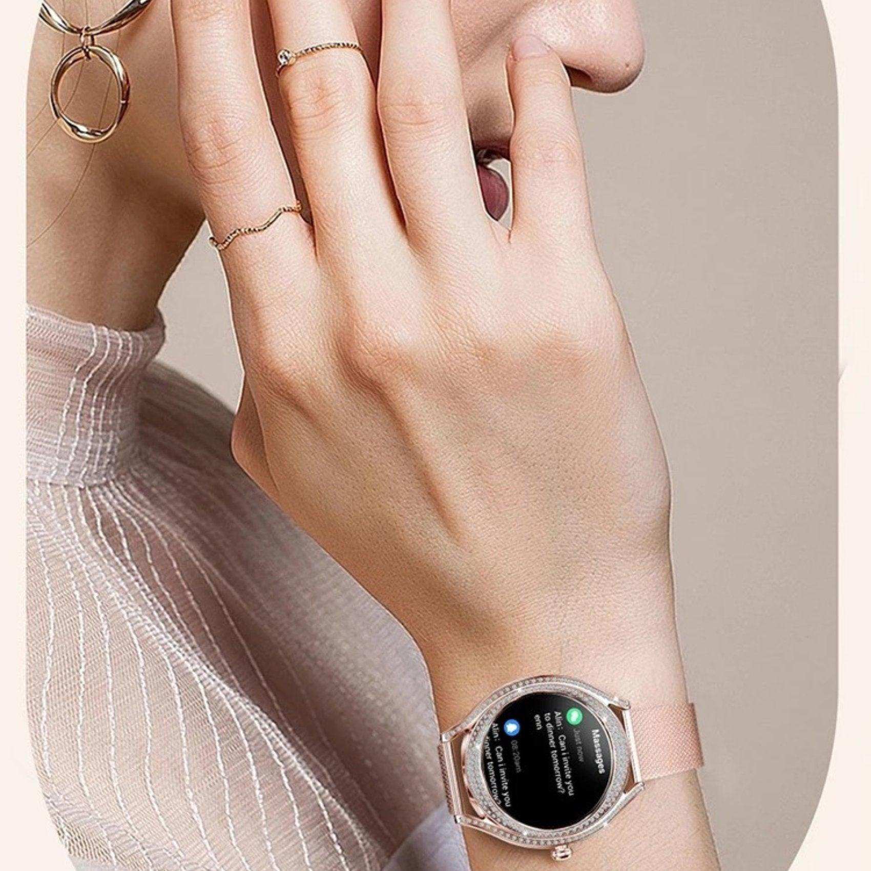 Elegant women's hand wearing rose gold smart watch with AMOLED display and zirconia bezel, TUTT