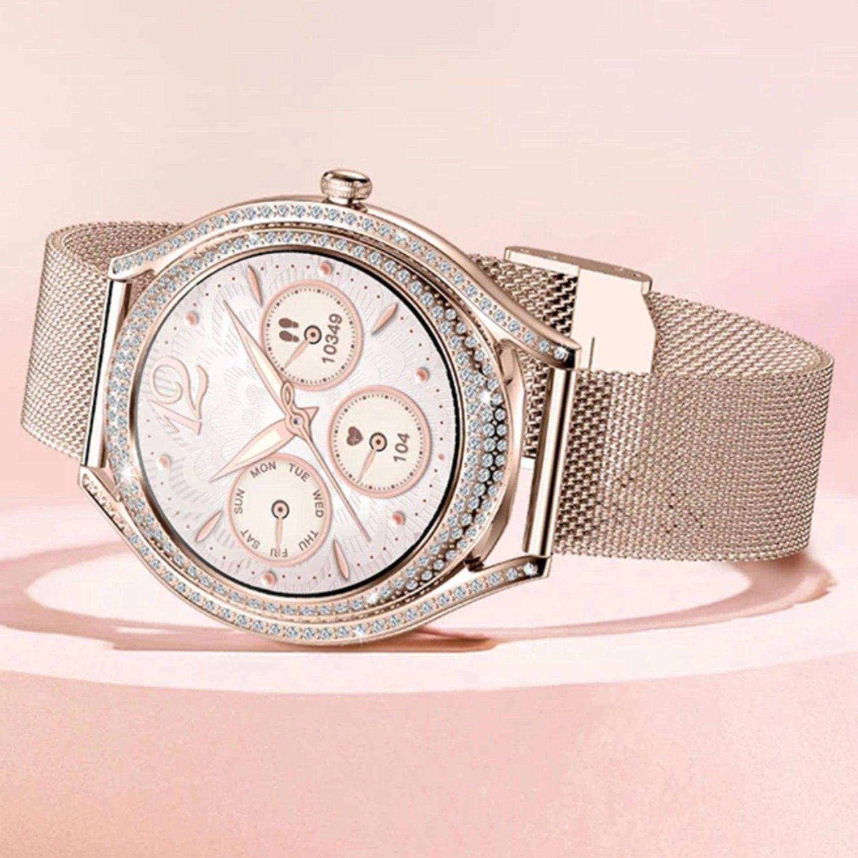 Elegant women's gold smart watch with mesh band, cubic zirconia bezel, and pink dial, TUTT
